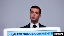 Jordan Bardella, president of the far-right National Rally (RN) party, attends a press conference to present policy priorities as part of the campaign for the upcoming French parliamentary elections, in Paris, June 24, 2024. 