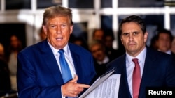 Former U.S. President Donald Trump speaks alongside his attorney Todd Blanche at the end of the day outside the courtroom during his hush money trial at Manhattan Criminal Court in New York, May 20, 2024.