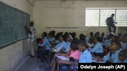 Students attend a math class at the Jean Marie Vincent High School in Port-au-Prince, Haiti, Thursday, July 25, 2024. 