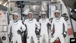 Russia cosmonaut Konstantin Borisov, left, Andreas Mogensen, Jasmin Moghbeli, and Japan astronaut Satoshi Furukawa ، onboard the SpaceX recovery ship MEGAN shortly after having landed in the Gulf of Mexico , March 12, 2024. (Joel Kowsky/NASA via AP)