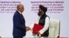 Mullah Abdul Ghani Baradar, the leader of the Taliban delegation, and Zalmay Khalilzad, U.S. envoy for peace in Afghanistan, shake hands after signing an agreement at a ceremony between members of Afghanistan's Taliban and the U.S. in Doha, Qatar…