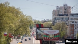 The coat of arms of Transnistria is depicted on a banner in central Tiraspol, self-styled capital of the pro-Russia separatist region in eastern Moldova, May 5, 2022.