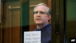 FILE - Paul Whelan, a former U.S. marine who was arrested for alleged spying, listens to the verdict in a courtroom at the Moscow City Court in Moscow, Russia, June 15, 2020. 