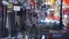 Military personnel walk down Bourbon street in New Orleans, Jan. 2, 2025. 