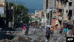 Residents evacuate Poste Marchands in Port-au-Prince, Haiti on December 9, 2024, after gangs took control of the region on December 7.