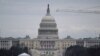 The US Capitol is seen as workers break down parts of the tents, after President-elect Donald Trump’s inauguration was moved indoors due to inclement weather, on January 18, 2025 in Washington, DC. (Photo by ANDREW CABALLERO-REYNOLDS / AFP)