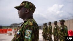 Kenyan members of the Multinational Security Support Mission (MSS) stand at attention as they wait the arrival of US Secretary of State Antony Blinken for a meeting at the base in Port Au Prince, Haiti on September 05, 2024.