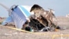 In this photo taken from a video released by the administration of Mangystau region, the wreckage of Azerbaijan Airlines Embraer 190 lies on the ground near the airport of Aktau, Kazakhstan, Dec. 25, 2024. 