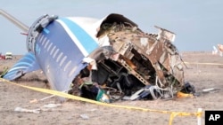 In this photo taken from a video released by the administration of Mangystau region, the wreckage of Azerbaijan Airlines Embraer 190 lies on the ground near the airport of Aktau, Kazakhstan, Dec. 25, 2024. 