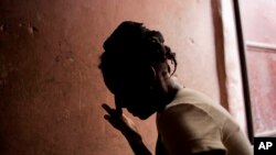 Martine Gestime 32, wipes her tears during an interview in Port-au-Prince, Haiti, Aug. 11, 2016. Gestime said she was raped by a Brazilian peacekeeper in 2008 and became pregnant with her son, Ashford. The medical charity Medecins Sans Frontieres says sex