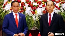 Ông Trần Đại Quang tiếp đón Tổng thống Indonesia Joko Widodo tại Hà Nội hôm 11/9.