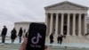 The TikTok logo is displayed on a mobile phone next to the U.S. Supreme Court, in this picture illustration