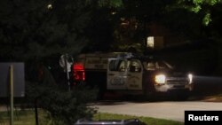 Law enforcement members guard the perimeter of the home of Republican presidential candidate and former U.S. President Donald Trump's shooting suspect