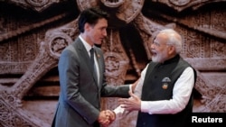 FILE PHOTO: Trudeau and Modi at G20 summit in India