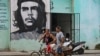 Cubans walk in a street of Havana, on January 14, 2025.