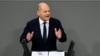 German Chancellor Olaf Scholz gives a speech during a session on November 13, 2024 at the Bundestag (lower house of parliament) in Berlin, following the breakdown of his three-party coalition.