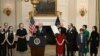 US President Joe Biden, standing alongside family members of the freed prisoners, speaks about the prisoner exchange with Russia, in the State Dining Room of the White House in Washington, DC, on August 1, 2024.