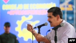 This handout picture released by the Venezuelan Presidency shows Venezuelan President Nicolas Maduro speaking during a meeting with the Productive Economy Council in Caracas on September 19, 2024.