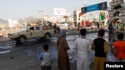 A Taliban car is seen guarding at the site of a blast in Kabul