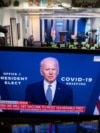 President-elect Joe Biden speaks about coronavirus as he appears on a television in the Brady Press Briefing Room of the White House in Washington, Nov. 9, 2020. 