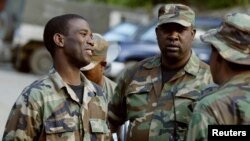 The high command of the rebel Haitian National Revolutionary Liberation Front, L-R, Commander in Chief Guy Philippe, Commander Ramicien Ravix and Commander Louis Jodel Chamblain