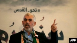 TOPSHOT - (FILES) Hamas' leader in the Gaza Strip Yahya Sinwar speaks during a press conference for Quds (Jerusalem) day in Gaza City on 30 May 2019.